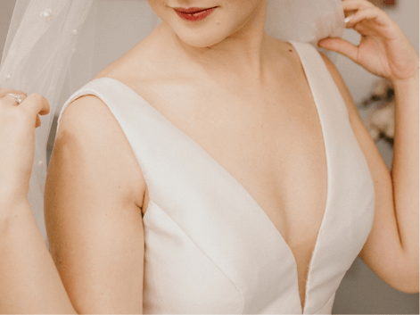 Woman wearing a V neck wedding dress