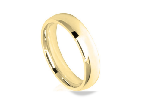 a yellow gold wedding band on a white background