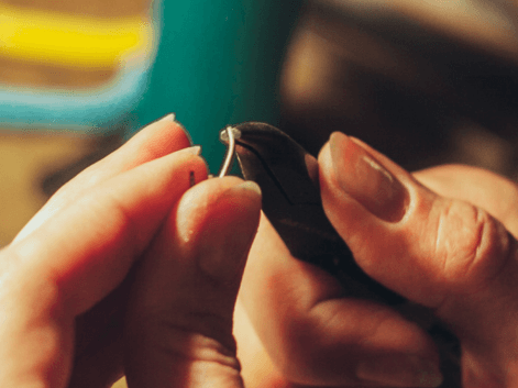 jeweller fixing a bent earring pole