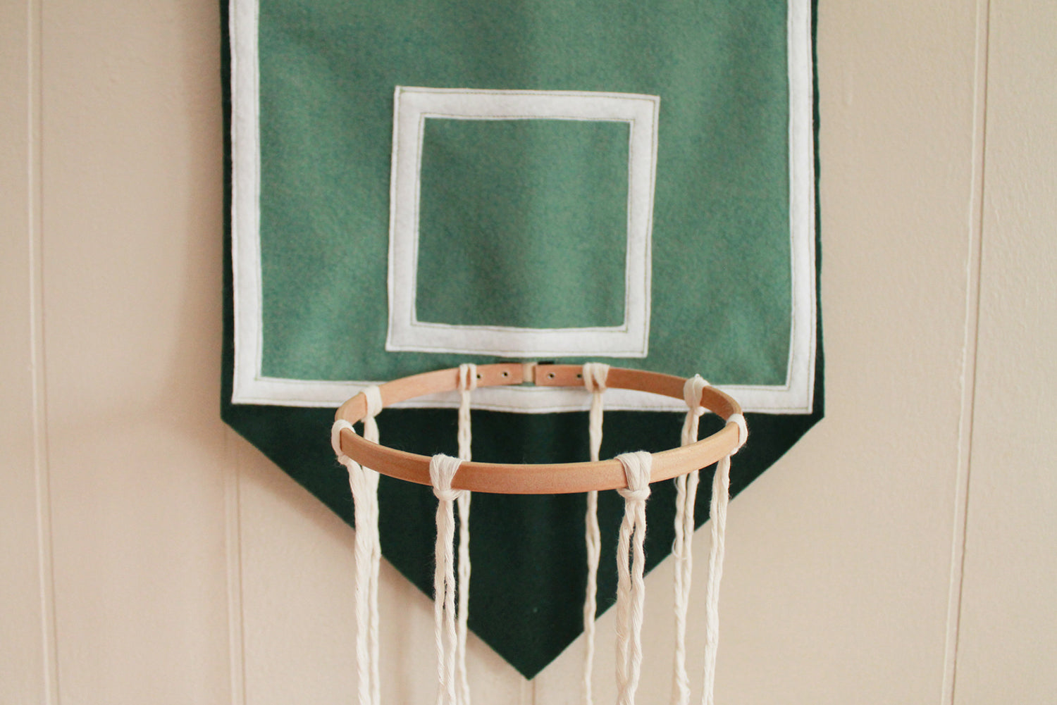 Add ropes around the embroidery hoop