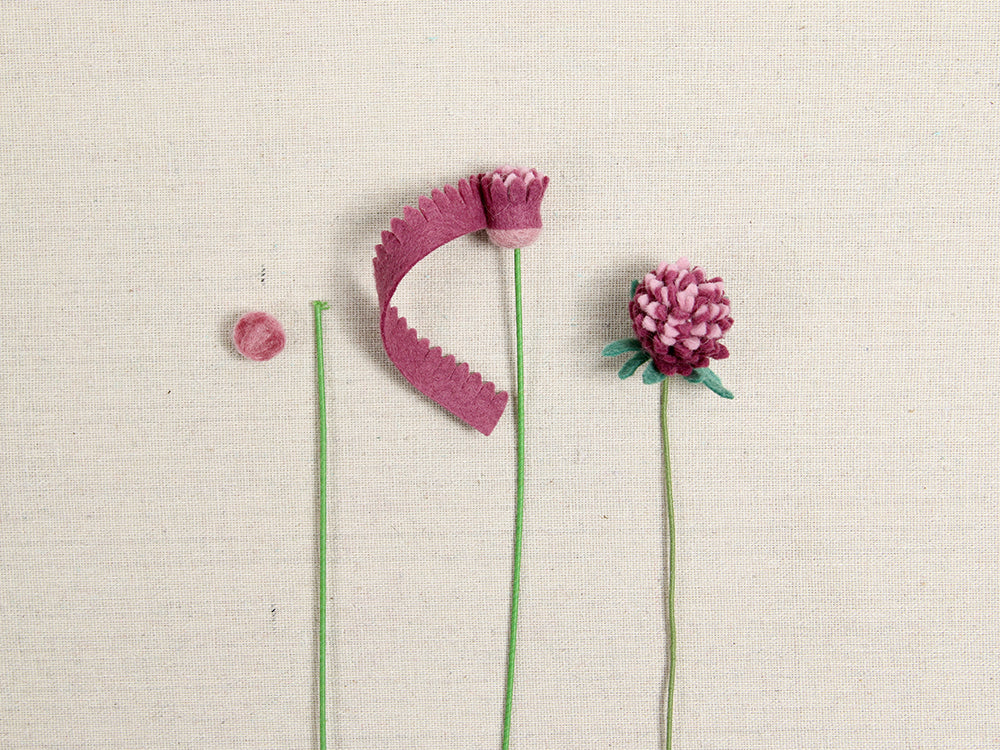 Wrapping Amaranth felt flower around stem