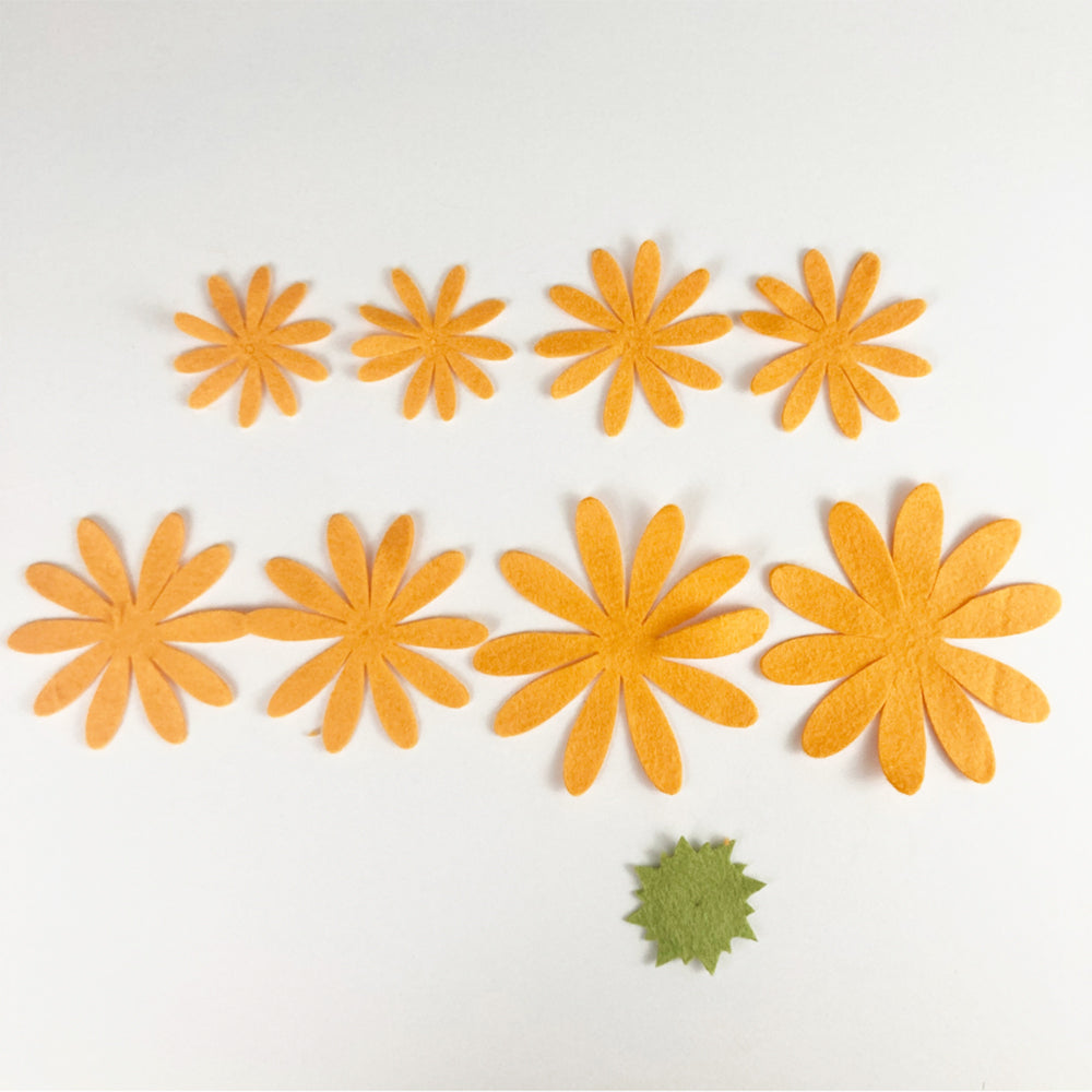 Cutting chrysanthemum pieces from felt