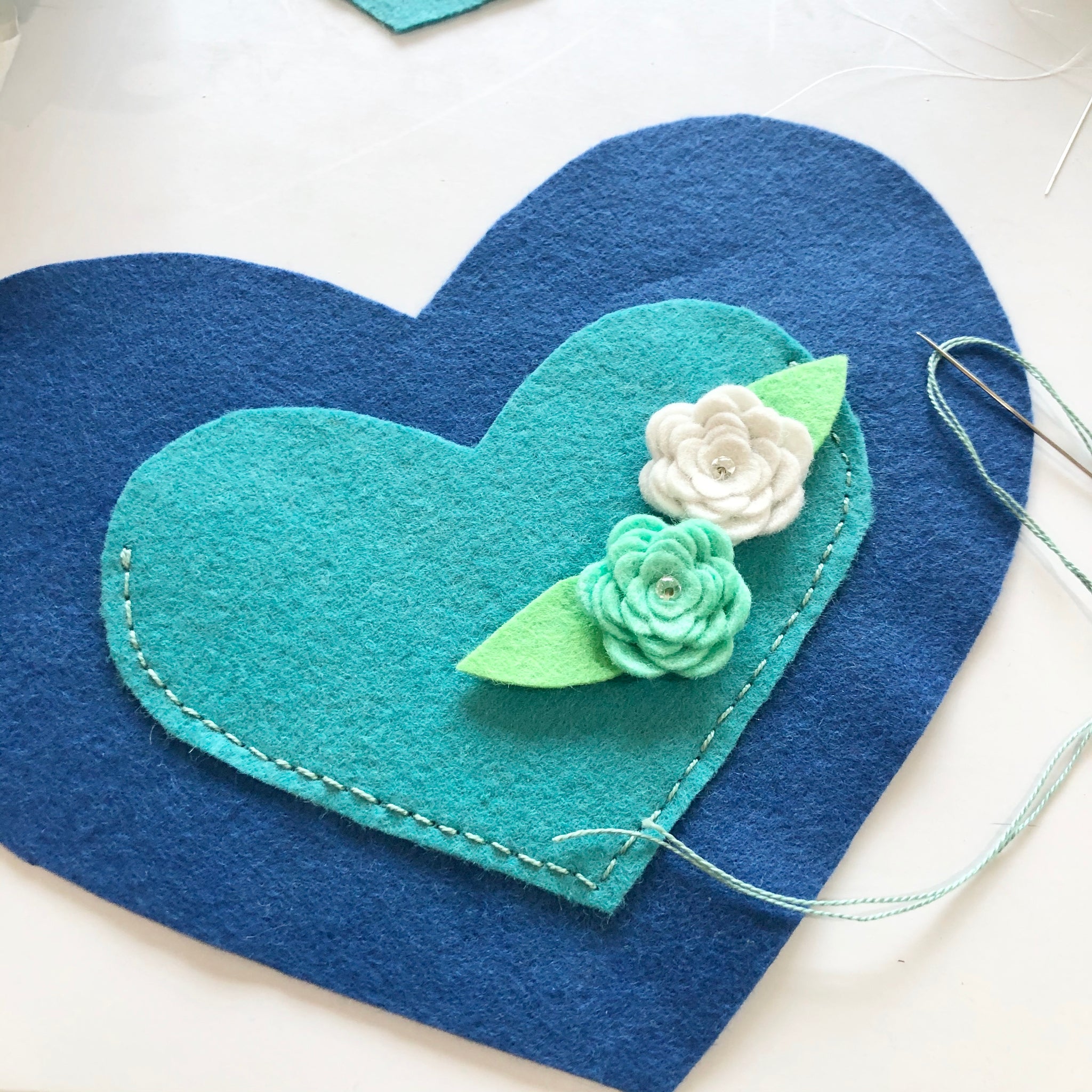 Wooden heart, decorated with fabric flowers and a linen Ribbon