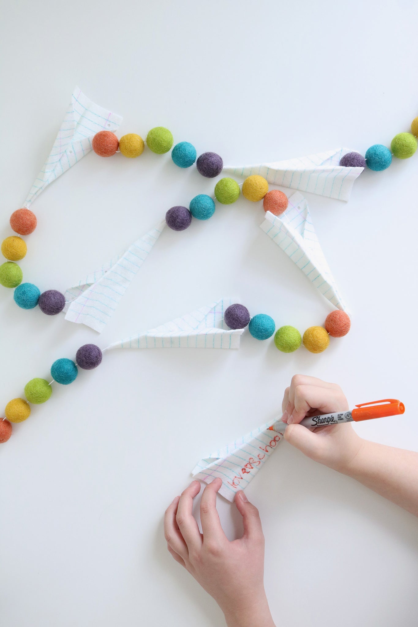 Adding embellishments to airplane garland