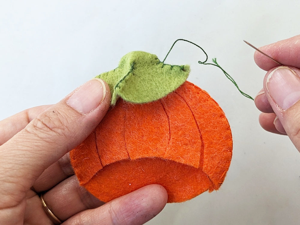 Sewing stem onto pumpkin head