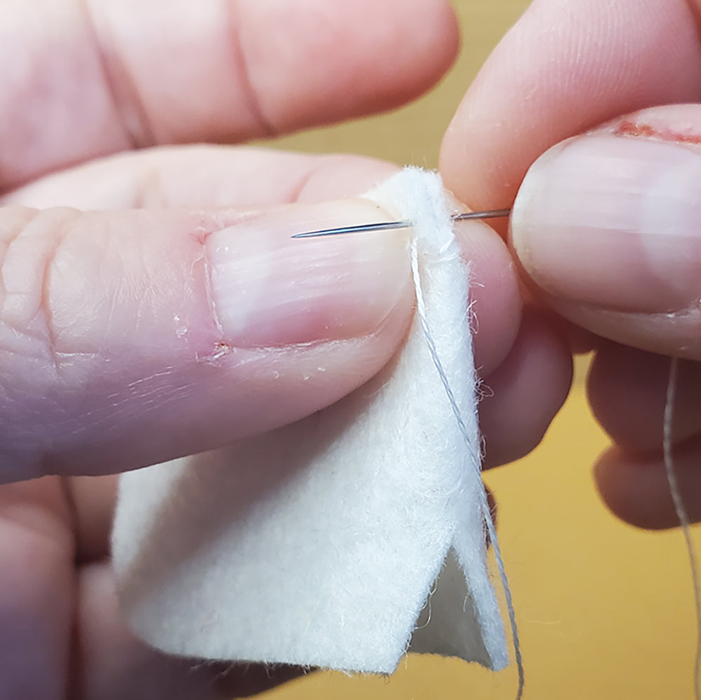 Sewing V cuts of mane together
