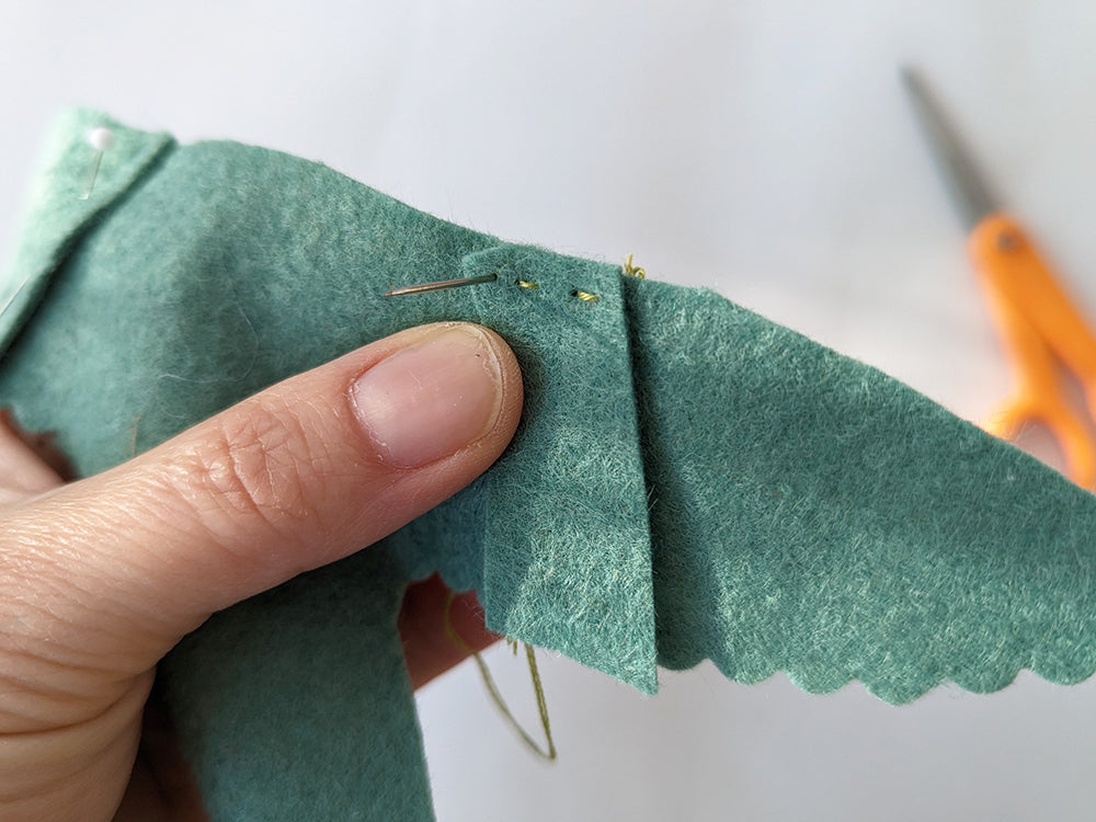 Sewing straps to wings