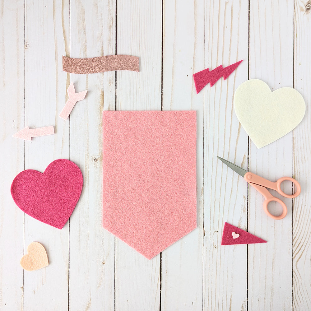 Cutting felt shapes for Valentine banner