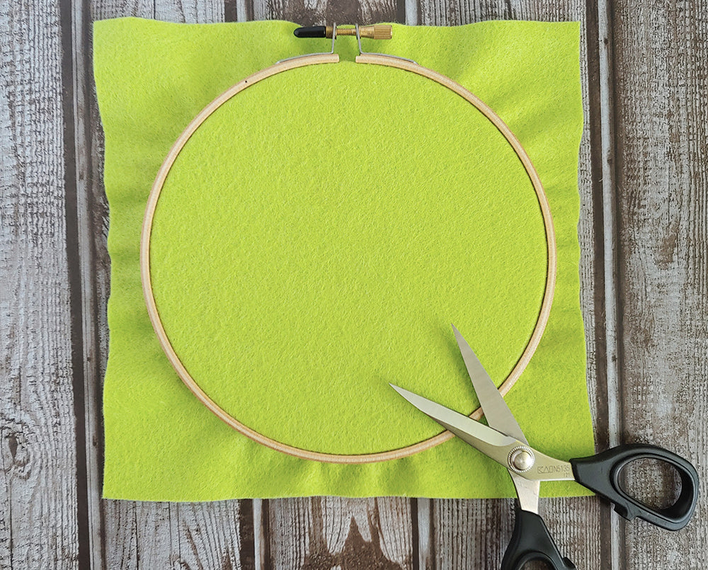 Positioning felt in embroidery hoop