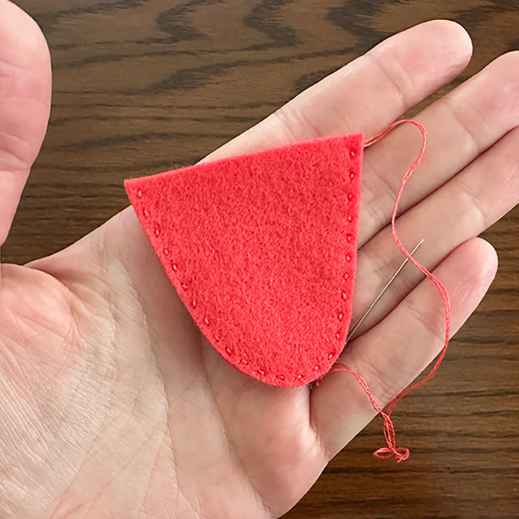 Stitching outer edge of strawberry