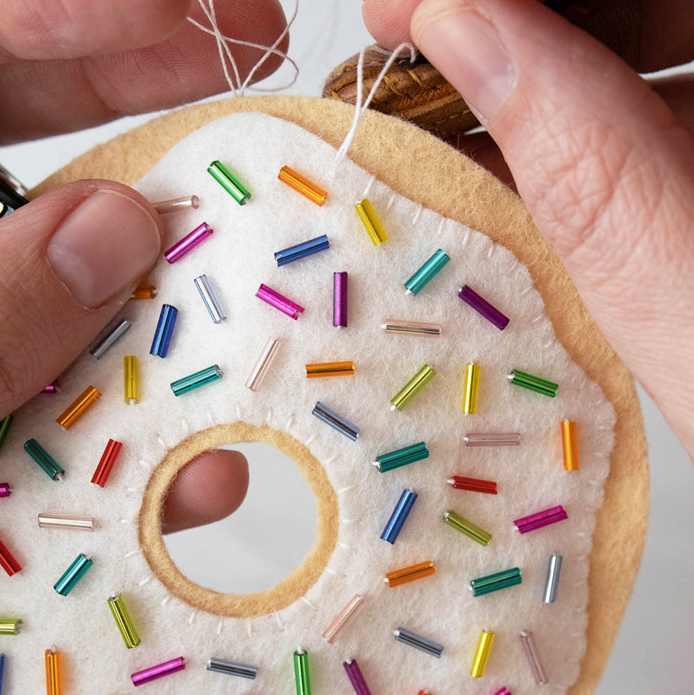 Whip stitch around outside of felt frosting