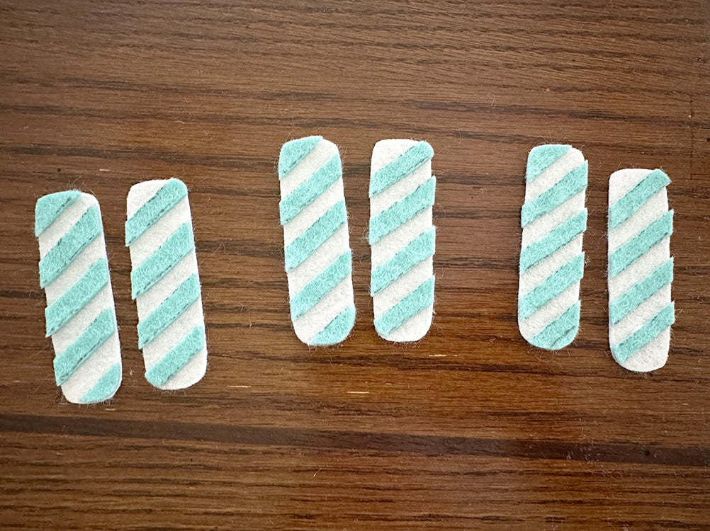 Adding teal stripes to linen candles