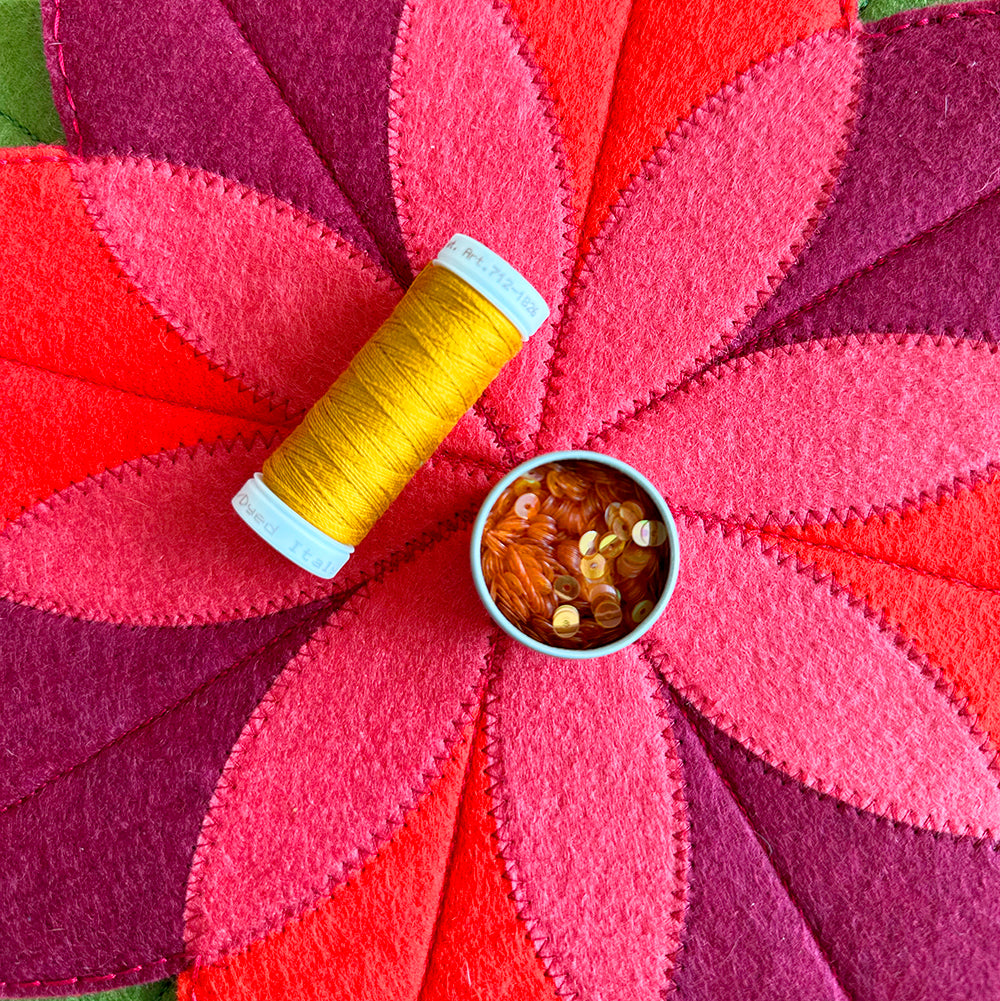 Adding sequins to poinsettia center