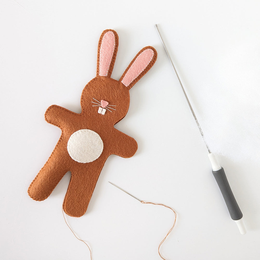 Stitching and stuffing bunny