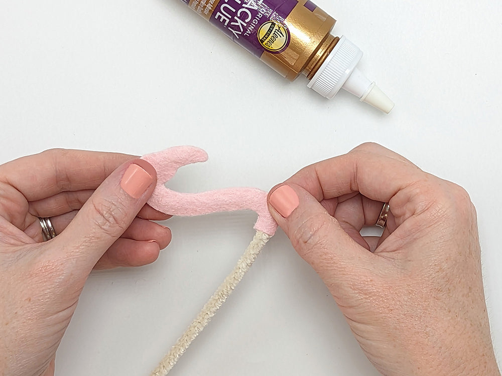Gluing head pieces together with pipe cleaner inside