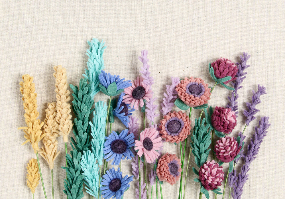 Finished assortments of felt florals with fringe