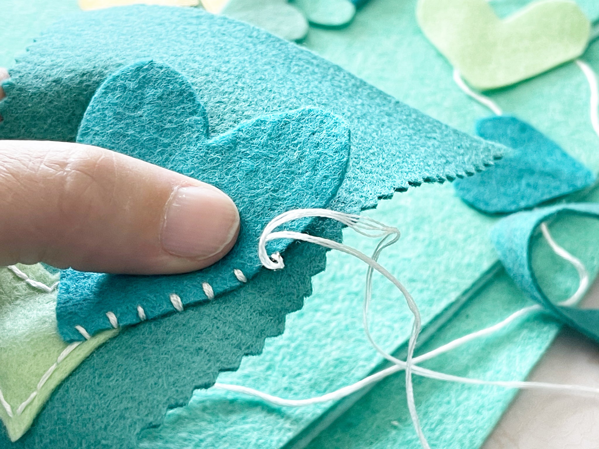 Stitching on felt hearts