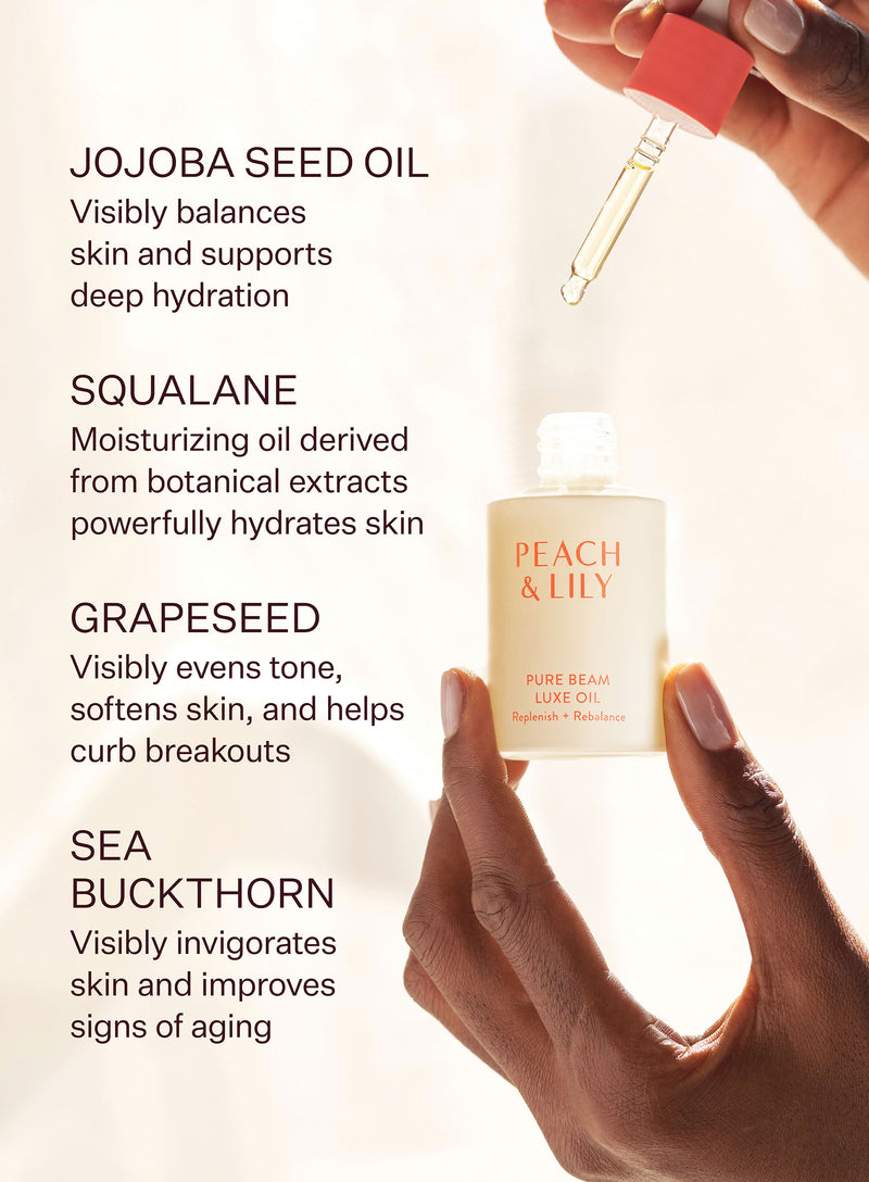 A Pure Beam Luxe Oil and dropped held up to the light and highlights of the ingredients used such as jojoba seed oil, squalane, grapeseed, and sea buckthorn