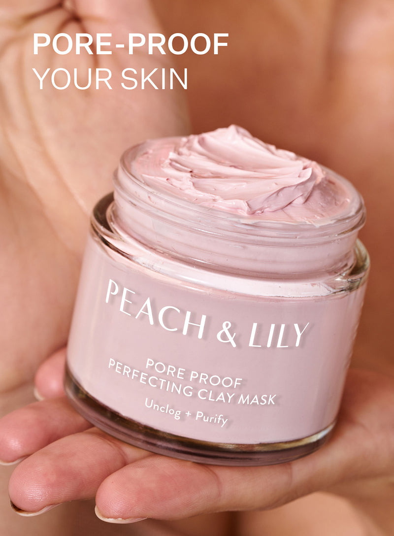 Someone holds a jar of Peach & Lily Clay Mask for Pores in their hand