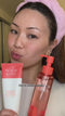 A young woman uses the Peach & Lily Double Cleansing Duo, showing how easy they are to apply and rinse off