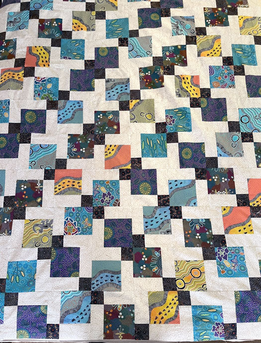 In-progress Disappearing 9 Patch quilt top using Australian fabric