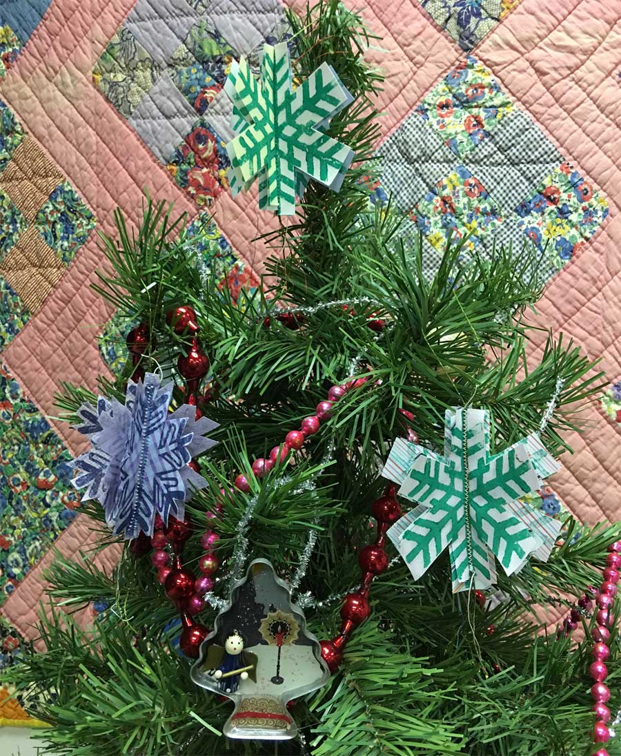 Block Printed fabric snowflakes created by Judy Gula using Terial Magic spray