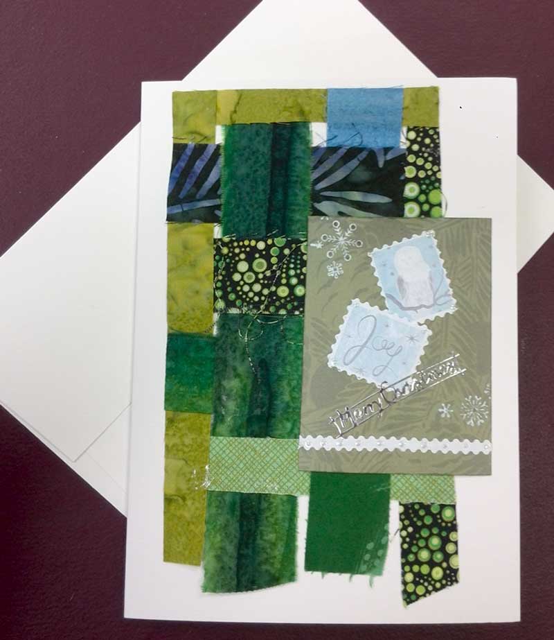 Joy greeting card by Judy Gula using woven fabric strips and Artist Trading Cards