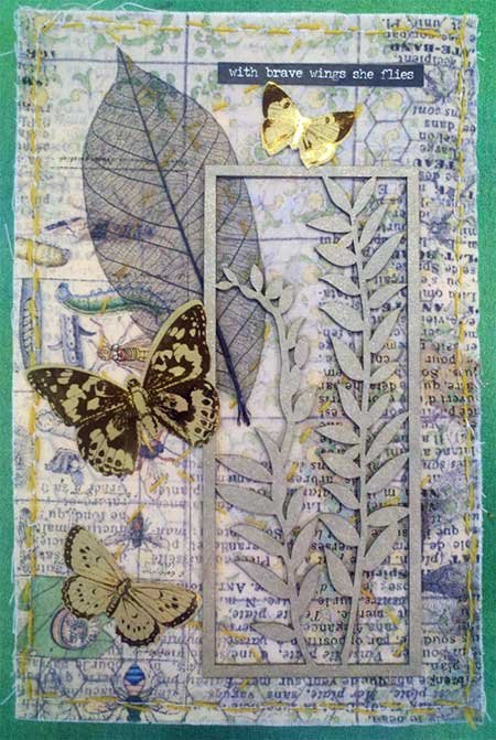 Artwork by Lindy Millman: Tim Holtz fabric, chipboard shape, skeleton leaf, ephemera