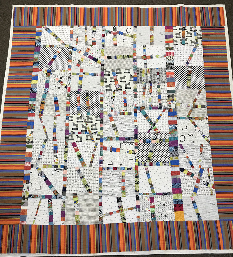 Modern scrap quilt by Judy Gula of Artistic Artifacts