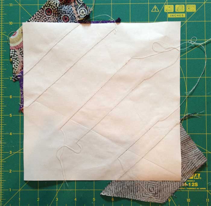 Stitching lines show on the reverse of the paper template