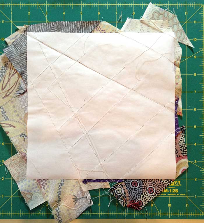 The reverse of a completed quarter block string pieced by Judy Gula