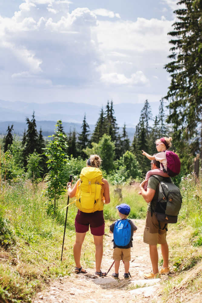 family walking on a hiking trail