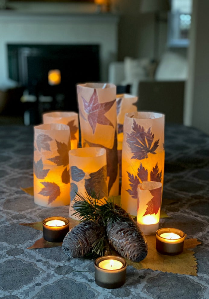 DIY fallen leaf luminaries are easy to make and a lovely way to enjoy the season. Try these after a nature walk with the kids to collect fallen leaves. Just waxed paper and a no-steam iron. #autumn #crafts #luminaries #naturecraft #processart