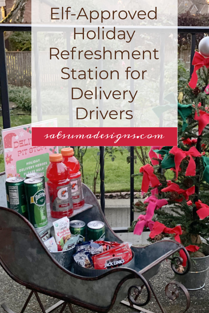 Photo of small metal sleigh on a front porch filled with snacks for delivery drivers