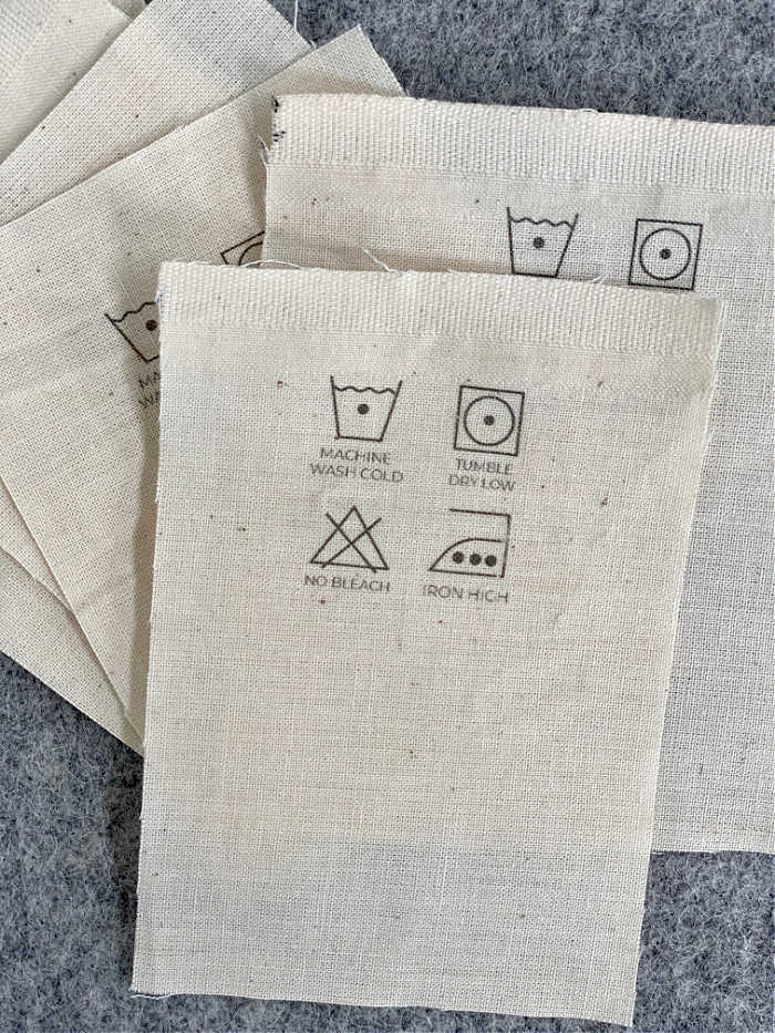 Photo of cotton care labels before being sewn