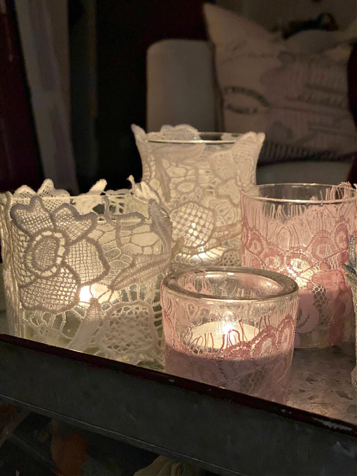 Learn how to easily make beautiful upcycled lace tea candle holders. With just a few materials you can create these lovely design elements that make super gifts too! #lace #craft #valentinesday #crafty