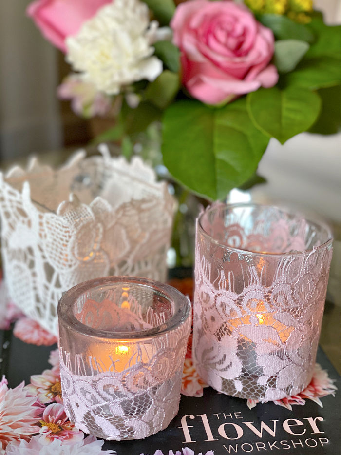 Learn how to easily make beautiful upcycled lace tea candle holders. With just a few materials you can create these lovely design elements that make super gifts too! #lace #craft #valentinesday #crafty