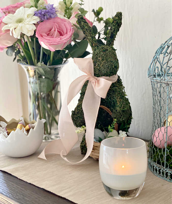How to style a festive Easter tablescape on a budget. See how I created delightful touches for a fun Easter table to welcome friends and family. #Easter #celebration #hostess #Eastertablescape #tabledesign