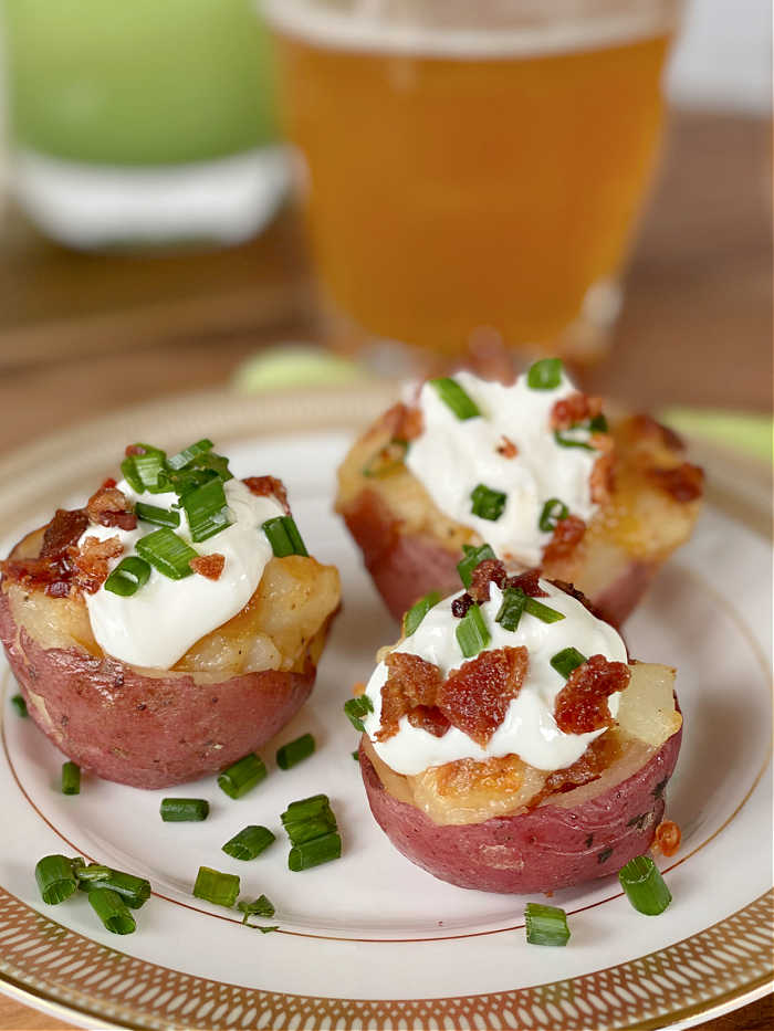 Loaded bacon cheddar twice baked potato bites recipe. This delicious recipe is a lovely way to celebrate St. Patrick's Day in March! #twicebakepotato #stpatricksdayrecipe #potatorecipes