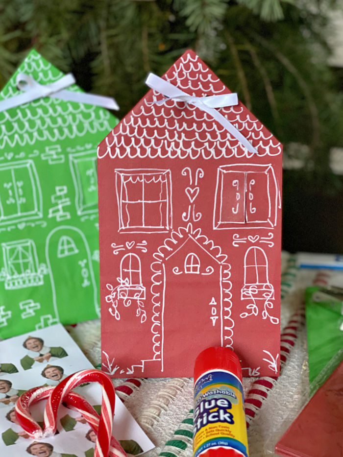 Photo of red paper bag house hanging on a front door