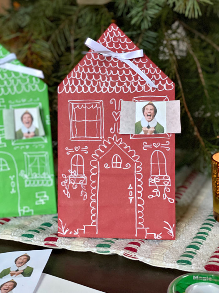 Photo of red paper bag house hanging on a front door