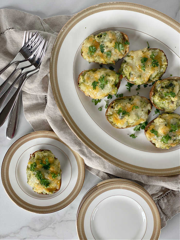 Broccoli and Cheddar Cheese Twice Baked Potatoes. Make these to serve for family feasts, weeknight dinners and great for lunch too! #broccolirecipes #eatyourgreens #gameday #potatoes