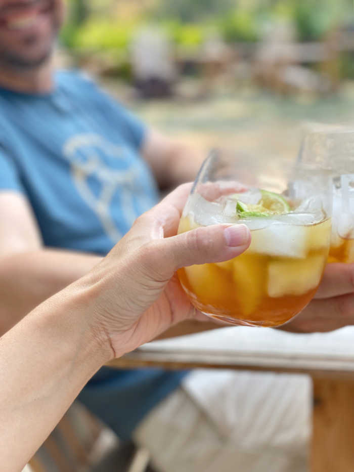 Photo of two people drinking dark and stormy rum cocktails
