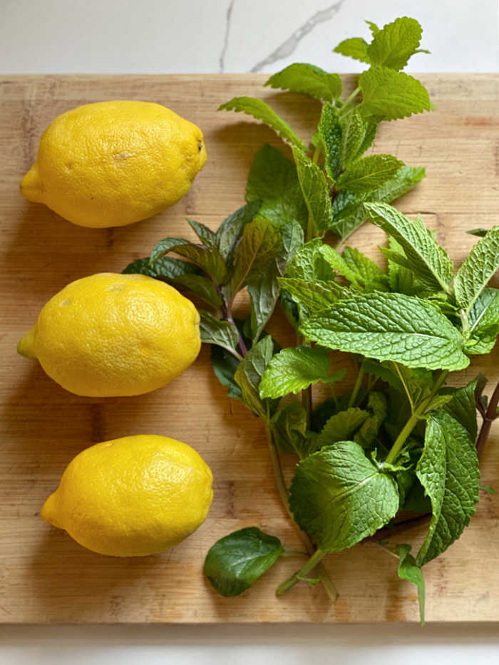 photo of lemons and fresh mint and basil herbs