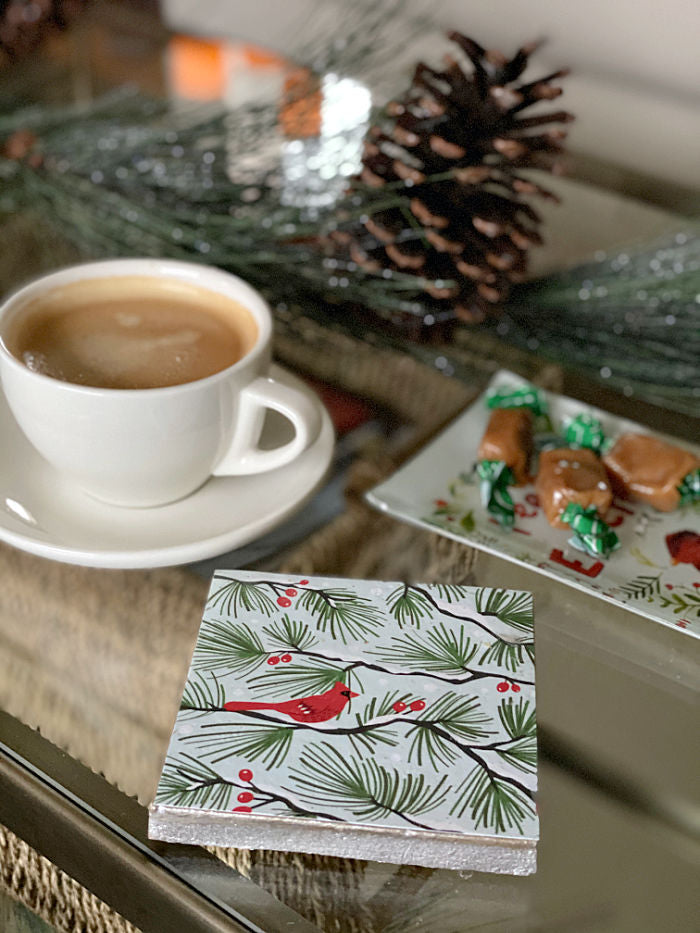 Discover how to upcycle holiday cards into coasters and trivets for gift giving, entertaining and holiday cooking. Enjoy this easy craft to try with the kids too! #holiday #upcycle #holidaycards #recycle #familytime