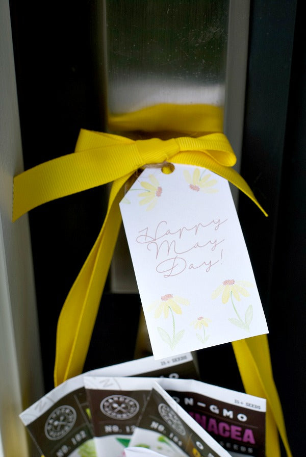 May Day Herbal Tea Gift Surprise. Share this easy May Day gift basket that includes herbal tea seeds in small peat pots. Includes my free printable May Day gift tag and plant tags. #mayday #maydaygift #giftideas #mothersdaygifts #gifts