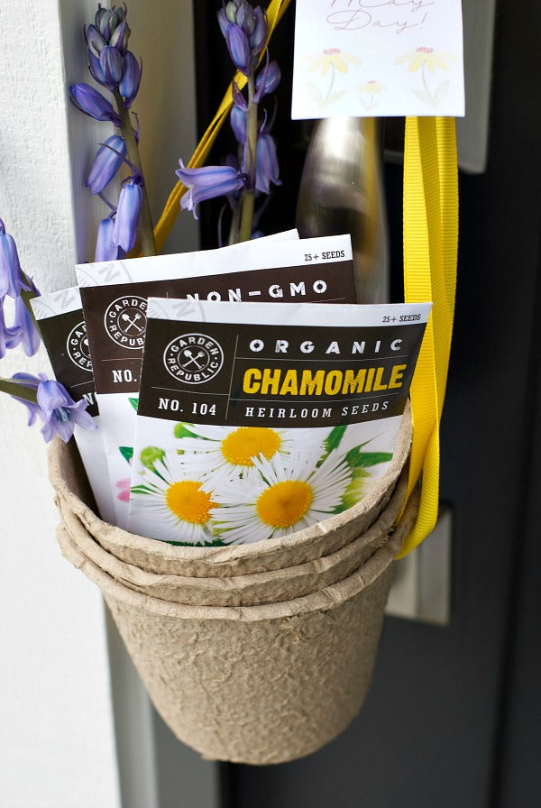 May Day Herbal Tea Gift Surprise. Share this easy May Day gift basket that includes herbal tea seeds in small peat pots. Includes my free printable May Day gift tag and plant tags. #mayday #maydaygift #giftideas #mothersdaygifts #gifts