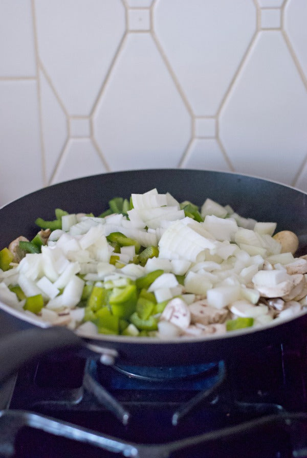 Philly cheesesteak burrito recipe for a quick and delicious weeknight meal. This easy recipe combines all the savory flavors of a philly cheesesteak with very affordable ingredients and the convenience of a burrito wrap! #philly #phillycheesesteak #dinner #whatsfordinner #burritorecipes #dinnerrecipes #savory #salty