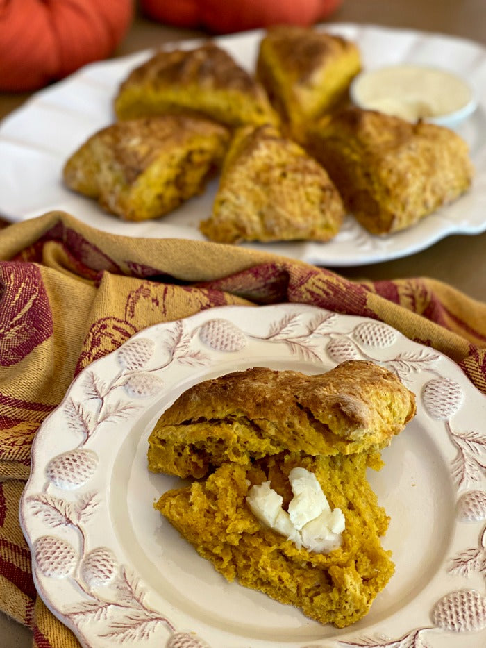 Savory pumpkin scones with honey butter recipe is a great way to welcome autumn. These easy to make scones are lightly spiced and delicious. #fall #autumn #scones #scone #fallyall #itsfallyall #pumpkin #pumpkins #fallharvest #seasonalrecipes #pumpkinspice