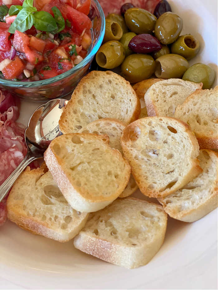 Photo of bread rounds on an antipasto platter